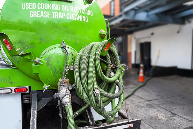 maintenance crew pumping grease trap at a fast food restaurant in Clairton